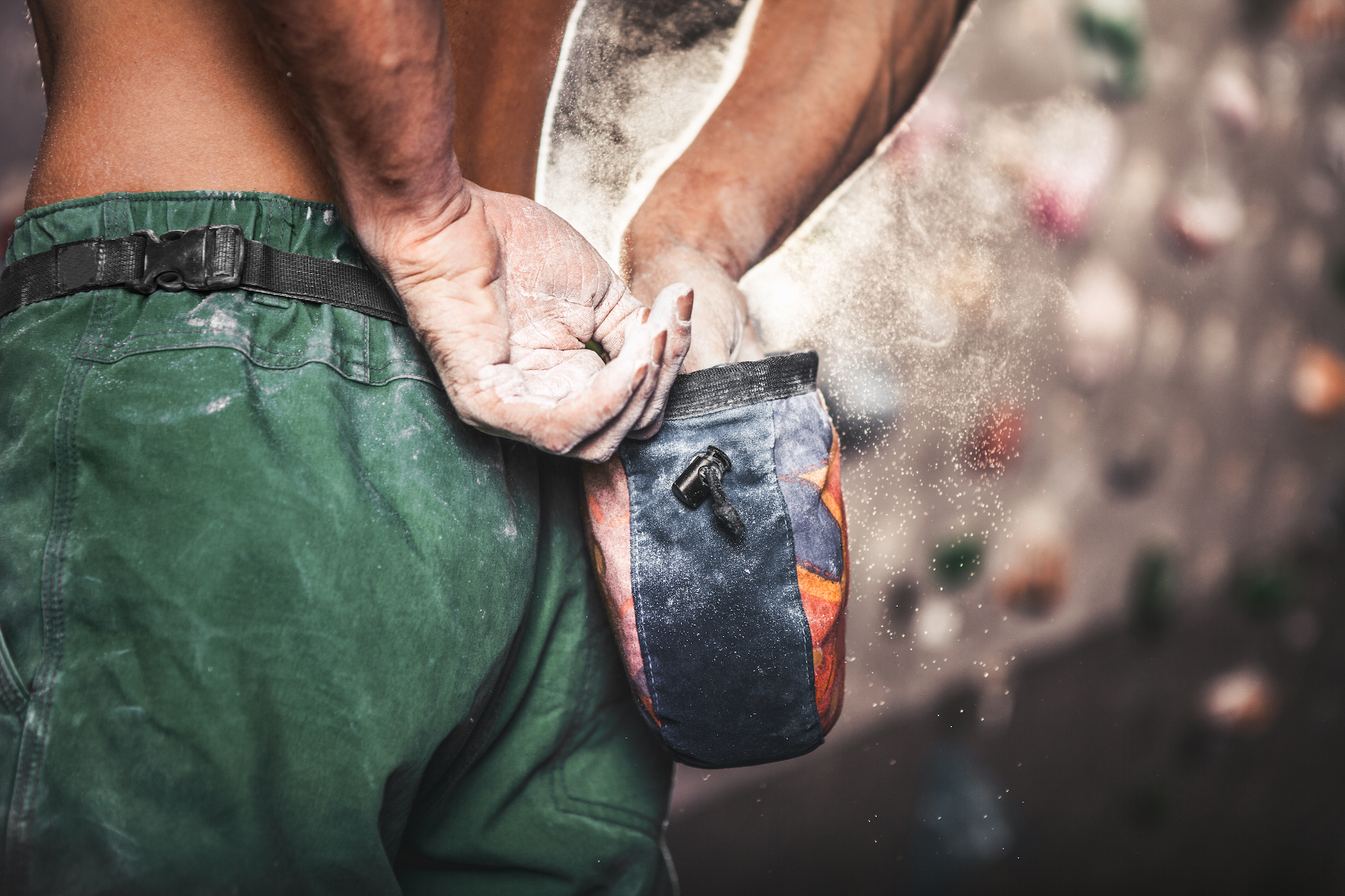 A climber's chalk bag on the wall during the Bouldering Baristas throwdown