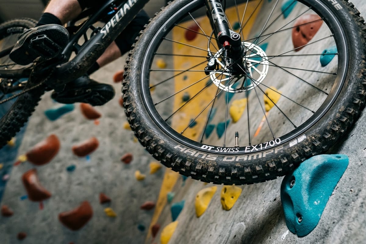 Close-up of mountain bike tire on a climbing hold